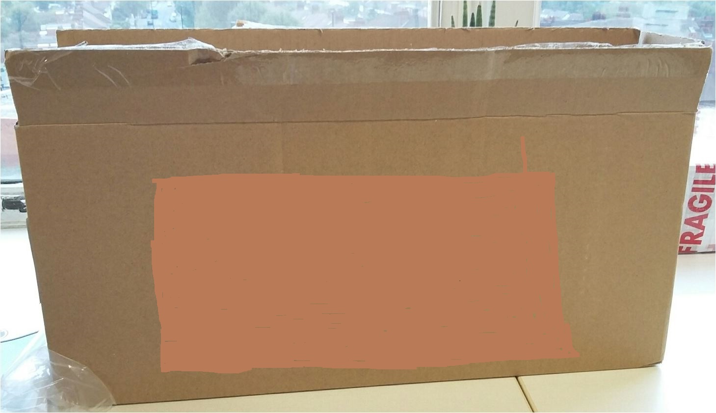 SINGLE CORRUGATED CARDBOARD BOX FOR PACKING, STORAGE AND SHIPPING. THE BOX IS MADE FROM 100% PAPER AND DISPLAYS A COMPANY LOGO.