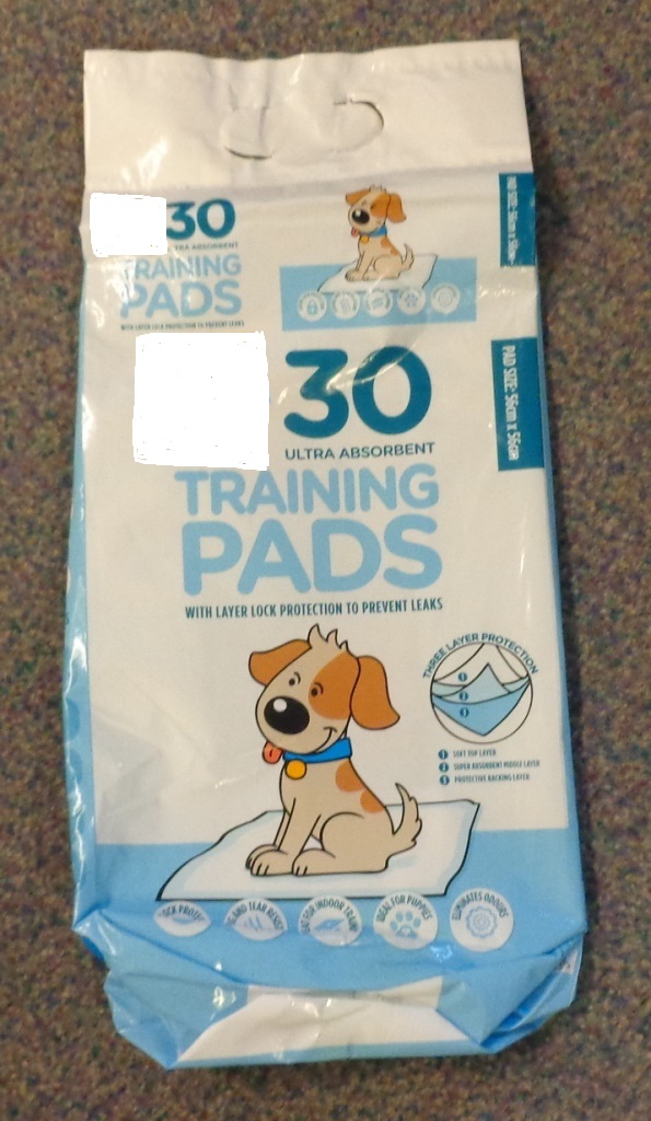 PACK OF 30 PUPPY TRAINING PADS DESIGNED TO BE PLACED ON THE FLOOR TO SOAK UP URINE DURING PUPPY HOUSE TRAINING. EACH PAD MEASURES 56 CM X 56 CM, WITH NON WOVEN POLYPROPYLENE SURFACE WITH TISSUE PAPER/SAP/FLUFF PULP FILLING AND PE BAVKSHEET. PACKAGED IN A COLOURFUL PLASTIC BAG WITH A HANDLE.