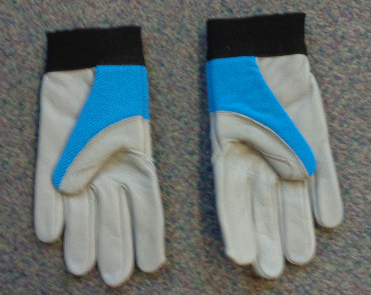 A PROFESSIONAL GARDENING GLOVE CONSISTING OF KNITTED SPANDEX WITH LEATHER FORMING THE PALM, THUMB, MAJORITY OF THE INDEX FINGER AND ALSO COVERING THE REST OF THE FINGER FRONTS AND THE BACK OF FOREFINGER AND RING FINGER TIPS. THERE IS A BAND OF LEATHER WITH RAISED DIMPLES SOWN ACROSS THE KNUCKLES. THE GLOVE FEATURES AN ELASTICATED WRIST BAND WITH VELCRO FASTENING TAB. COLOUR: BLUE KNITTED FABRIC WITH GREY LEATHER AREAS AND BLACK WRISTBAND.