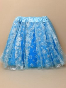 A TURQUOISE BLUE CHILD SIZE TUTU WITH TRIPLE NETTING  AND SILVER GLITTER SNOWFLAKES. MADE FROM KNITTED POLYESTER.USED FOR CHILDREN AS A DRESSING UP ITEM FOR PARTIES AND EVENTS, IT IS WORN OVER CLOTHING. PACKAGED IN A PP BAG WITH EURO HOLE  READY FOR SALE TO THE PUBLIC.