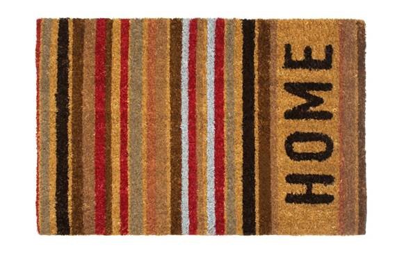 A DOOR MAT MADE OF COIR. INDIVIDUAL COIR FIBRES ARE IMPLANTED INTO A PVC BASE, WHICH IS HEATED TO ALLOW THE FIBRES TO BE IMPLANTED INTO THE MOLTEN MAT. THE MAT THEN COOLS DOWN TO ROOM TEMPERATURE TRAPPING THE COIR FIBRES WITHIN THE PVC. FOLLOWING THIS, THE MAT IS CUT ALONG THE TOP TO ENSURE THAT THE COIR IS A UNIFORM LENGTH. THE MAT IS THEN CUT TO THE REQUIRED SIZE. THE MAT MEASURES 600MM X 400MM AND IS APPROXIMATELY 15MM TALL IN TOTAL. THE PVC LAYER AT THE BOTTOM IS ALSO 600MM X 400MM, BUT IS ONLY 3MM THICK.