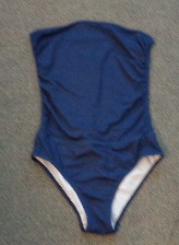 ALL IN ONE MULTI WAY TO WEAR SWIMWEAR BOTTOMS THE TOP OF WHICH CAN BE FOLDED OVER TO MAKE A SKIRT OF VARYING LENGTHS OVER THE BIKINI BOTTOM. MADE FROM 82% POLYESTER, 18% ELASTANE, KNITTED MATERIAL.
