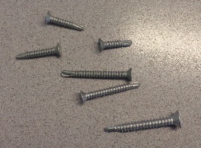 FLAT HEAD, CROSS RECESS, SELF TAPPING THREAD, DRILL POINT SCREWS. MANUFACTURED FROM MARTENSITIC STAINLESS STEEL WITH SILVER TWO STAGE CHROMIUM FREE INORGANIC ANTI-CORROSION COATING. FOR USE IN THE MECHANICAL JOINTING OF ITEMS TO METAL, COMPOSITE MATERIAL AND PVCU.