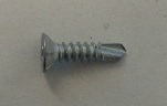 FLAT HEAD WITH UNDER-HEAD RIBS, CROSS RECESS, SELF TAPPING THREAD, DRILL POINT SCREWS. MANUFACTURED FROM MARTENSITIC STAINLESS STEEL WITH SILVER TWO STAGE CHROMIUM FREE INORGANIC ANTI-CORROSION COATING. FOR USE IN THE MECHANICAL JOINTING OF METAL, COMPOSITE MATERIALS AND PVCU.