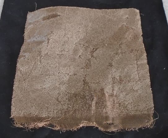 BRONZE FABRIC PRE-IMPREGNATED WITH EPOXY RESIN.  THE PREIMPREGNATED FABRIC IS PROTECTED WITH A YELLOW PLASTIC SEPARATOR ON ONE SIDE AND A WHITE SILICON PAPER ON THE OTHER SIDE TO PREVENT DETERIORATION . THE PRODUCT IS PACKAGED IN A HERMETICALLY SEALED ROLL OF A  WIDTH 1200MM +/- 10MM, LENGTH 40M +/- 5M.  MAX WEIGHT 50KG,