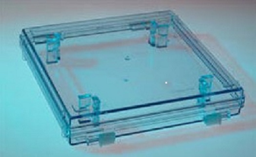 A PHOTOMASK COMPACT. USED FOR THE HOUSING, STORAGE, HANDLING AND MOVEMENT OF A PHOTOMASK IN A PARTICLE FREE ENVIRONMENT INSIDE A PHOTOLITHOGRAPHY OR SEMICONDUCTOR FABRICATION FACILITY. MADE OF BLENDED THERMOPLASTICS PROVIDING SPECIAL ELECTROSTATIC DISCHARGE (ESD) AND OUTGASSING PROPERTIES. MATERIALS INCLUDE BUT ARE NOT LIMITED TO; CARBON FILLED POLYCARBONATE, ACRYLONITRILE BUTADIENE STYRENE (ABS) AND POLYPROPYLENE EACH HAVING NONPOROUS, ABRASION RESISTANT OR IMPACT RESISTANT SURFACE PROPERTIES. COMPACT CONTAINS SPECIALLY DESIGNED RETAINER SYSTEM TO PROTECT THE PHOTOMASK FROM SURFACE OR COSMETIC DAMAGE AND IS AVAILABLE EITHER WITH OR WITHOUT A GASKET SEAL.