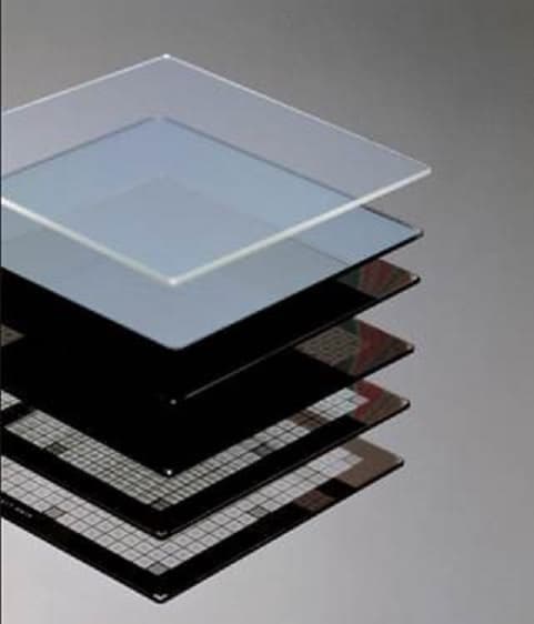 PHOTOMASK BLANK. A PLATE, COVERED WITH A FILM OF CHROMIUM AND COATED WITH A PHOTOSENSITIVE OR ELECTRON-SENSITIVE RESIN.THE PLATE/BLANK IS IMAGED USING LASER WRITING TOOLS WITH BESPOKE CIRCUIT DIAGRAM PATTERNS, THEN PROCESSED USING DEVELOP AND ETCHANT TYPE CHEMICALS TO MAKE A PHOTOMASK.PACKAGING OF THE BLANKS INVOLVES LIGHT SENSITIVE MULTICARRIERS WHICH SIT INSIDE CUSHIONED CARDBOARD CONTAINERS OFTEN SHIPPED ON PALLETS TO PROTECT FROM EXCESS VIBRATION. THESE BLANKS ARE AVAILABLE IN SIZES FROM 3 INCHES TO 14 INCHES. THEY CAN BE MADE FROM QUARTZ OR SODA LIME GLASS.