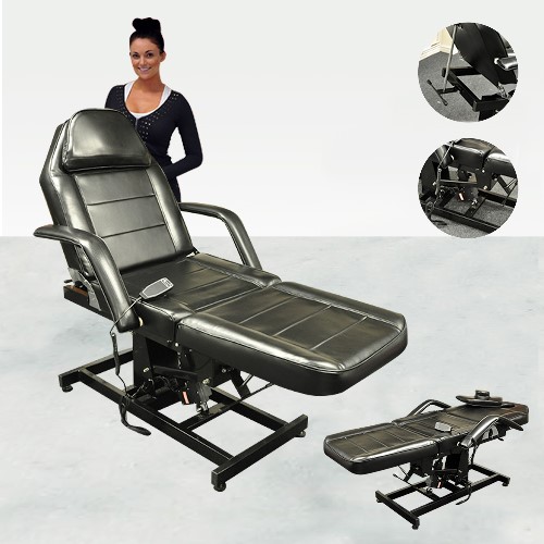 MASSAGE CHAIR BED WITH STEEL FRAME UPHOLSTERED IN BLACK FAUX LEATHER. THE PRODUCT CAN BE RAISED AND LOWERED VIA AN ELECTRIC MOTOR AND CAN CHANGE FROM A FLAT BED TO A CHAIR VIA THE HINGED TILTING MOVEMENT.