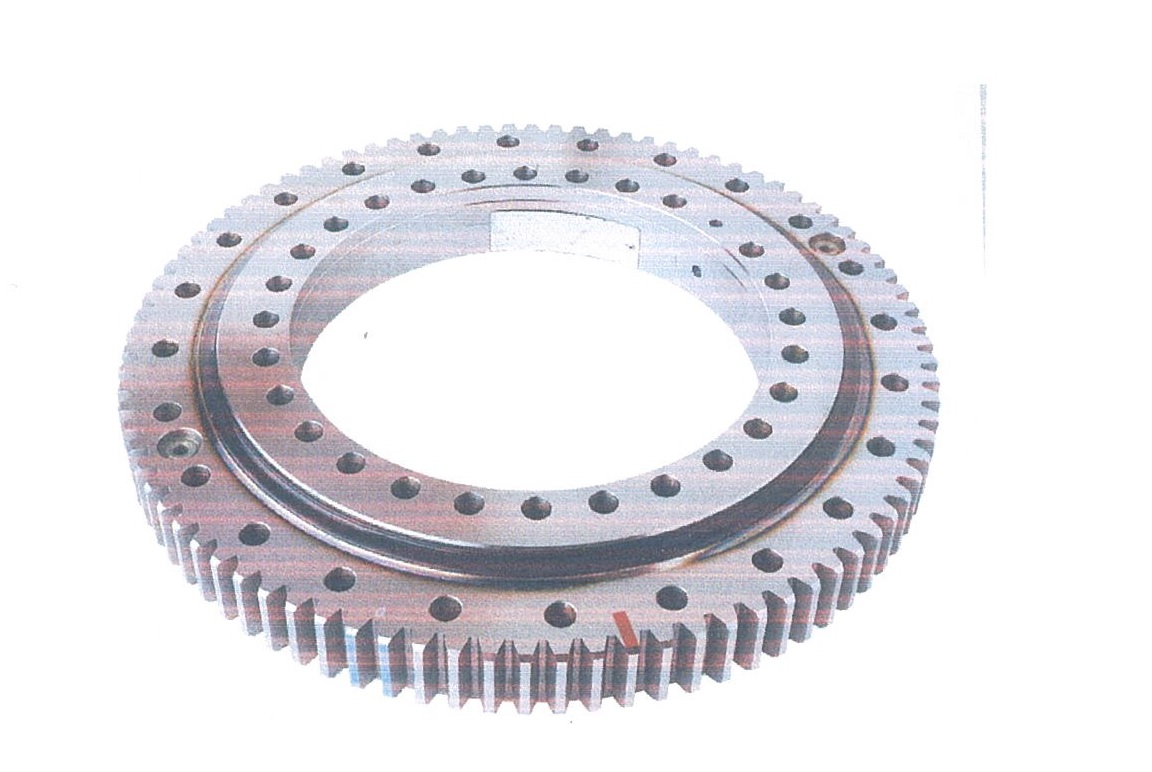 SLEWING RING, A ROTATIONAL ROLLING-ELEMENT BEARING TO SUPPORTS A HEAVY USUALLY OF SLOW TURNING LOAD. IT CONSISTS OF BEARING ELEMENTS WITH AN INNER AND AN OUTER (WITH GEAR TEETH) RINGS. THERE ARE FIXING HOLES AND TOLERATANCE PILOT DIAMETERS WHICH ALLOW LOCATION AND FIXING OF THE ASSEMBLY YO THE MATINF STRUCTURE. WITH THE EXTERNAL DIAMETER EXCEEDING 30MM.