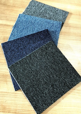POLYPROPYLENE TUFTED CARPET TILES WITH A SIZE OF 50 X 50 CENTIMETRES. PVC BACKING
