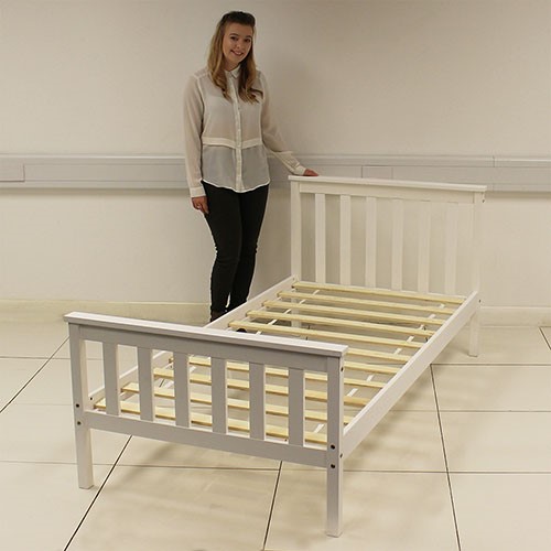 A BED FRAME MADE FROM SOLID PINE WITH A TRADITIONAL SUBTLE WHITE PAINT FINISH. IT HAS A SLATTED BASE AND INCLUDES HEADBOARD AND MID FOOT END. SINGLE SIZED BED MEASURING 196 X 98 X 82 CM. COMES FLAT PACKED WITH BRASS SCREWS AND HEX KEY SUPPLIED FOR EASY ASSEMBLY. PACKAGED IN A BOX WITH FULL COLOUR LABEL FOR RETAIL SALE. MATTRESS IS NOT INCLUDED.