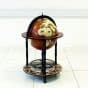 WOODEN DRINKS CABINET. THIS GLOBE BAR IS A 60CM DIAMETER GLOBE DRINKS CABINET THAT CAN STORE UP TO 4 BOTTLES AND 12 GLASSES. IT HAS CASTOR WHEELS FOR EASY MOVEMENT. ANCIENT WORLD MAP THEME TOP HALF OF THE GLOBE WHICH CAN SPIN. LEGS ARE HANDCRAFTED FROM SOLID HARDWOOD WITH A CHESTNUT STAIN.