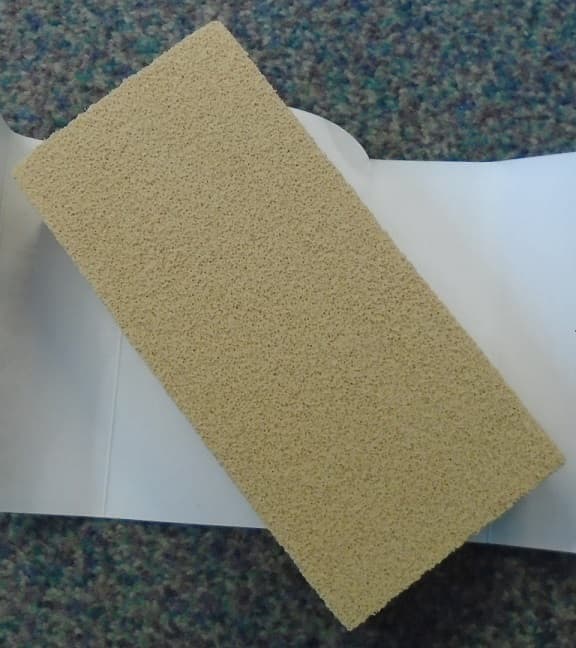 A VULCANISED RUBBER SPONGE FOR USE IN REMOVING PET HAIR, LINT AND DUST FROM VARIOUS SURFACES AND CLOTHING. IT MEASURES ABOUT 15.5 X 7 X 4 CENTIMETRES. BEIGE IN COLOUR. HAS A CARD WRAPPED ROUND FOR RETAIL SALE.