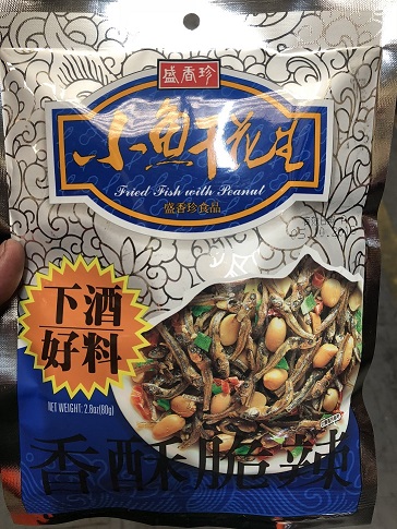 A DRIED FISH WITH PEANUTS SNACK. INGREDIENTS ARE PEANUTS, DRIED ANCOVIES (LESS THAN 20%), SESAME SEED, GREEN ONION, SALT, RED CHILLI, NUCLEOTIDE SEASONING, ANTIOXIDANT E320. THE PEANUTS HAVE BEEN FRIED, AND THE FISH HAS BEEN COATED WITH SUGAR AND THEN BAKED. CONTAINED IN AN 80 GRAMME PACK.