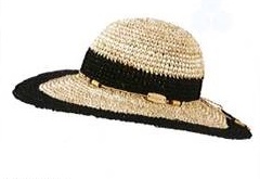 LADIES STRAW HAT WITH LARGE BRIM.  MADE OF 100% STRAW.  THE STRAW STRIPS ARE 0.5 CM WIDE AND PRE-MADE INTO PLAITING STRIPS.  THE PLAITING STRIPS ARE THEN SEWN IN TO A SPIRAL CONSTRUCTION TO FORM THE HAT.   THE HAT HAS DECORATIVE BAND AROUND THE JOIN OF THE HAT AND EDGE OF THE BRIM.  THE HAT ALSO HAS DECORATIVE TIE TIED INTO A BOW AROUND THE JOIN OF THE HAT AND THE BRIM.