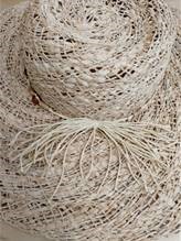 LADIES HAT WITH A BRIM AND DECORATIVE TRIM.  MADE OF 100% STRAW.  THE STRAW STRIPS ARE 0.2 CM AND 0.5 CM THAT ARE WOVEN TOGETHER TO MAKE LARGER STRIPS WHICH ARE 2.5CM WIDE. THESE 2.5 CM WOVEN STRIPS ARE THEN PLACED INTO A SPIRAL CONSTRUCTION TO FORM THE HAT.