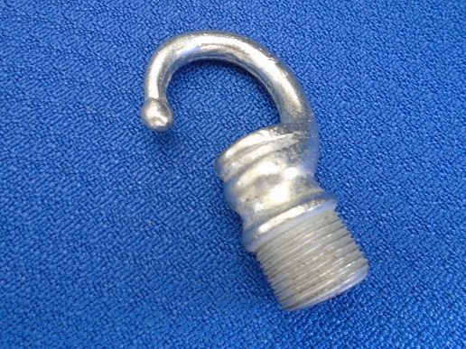THREADED DIE CAST MALE HOOK MADE FROM DIE CAST ZINC WHICH IS FORMED IN CASTINGS AND THEN POLISHED. IT HAS A HOLLOW CIRCLUAR CENTRE WITH A HOOK TO ONE SIDE AND A SCREW THREAD AT THE END.