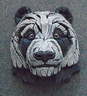 SCULPTURE OF A PANDA'S FACE.  FOR ORNAMENTAL USE.  SCULPTURE HAS 'OPEN FORM' DESIGN TO ALLOW LIGHT TO PASS THROUGH IT.  MADE FROM MARBLE STONE POWDER, POLY RESIN, DYE, CATALYST AND ACRYLIC PAINT.  SCULPTURE IS 26 CMS IN HEIGHT AND 24 CMS WIDE.  THE SCULPTURE HAS A CELLOPHANE COVERING AND IS THEN PACKAGED IN EXPANDED POLYSTYRENE IN A CARDBOARD BOX READY FOR RETAIL SALE.  MODEL NUMBER AND PICTURE OF THE SCULPTURE IS ON THE SIDE AND TOP OF THE BOX.  PRINTED BOOKLET SHOWING OTHER SCULPTURES AND COMPANY DETAILS.
