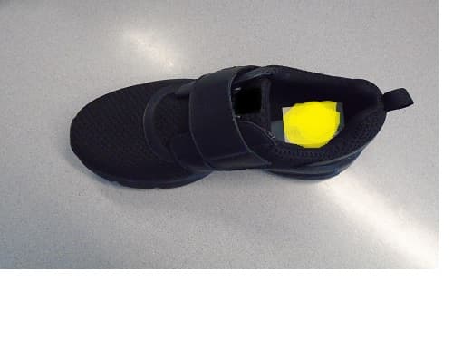 LADIES SHOE FOR SPORTS WEAR.  UPPER OF TEXTILE MATERIAL AND LEATHER.  THE TEXTILE MATERIAL IS THE PREDOMINATE MATERIAL OF THE UPPER.  LEATHER VELCRO FASTENING STRAP ACROSS VAMP.  SHOE IS BLACK IN COLOUR. TEXTILE DIAMOND PATTERNED HEEL COUNTER WITH LEATHER REINFORCEMENT AND TEXTILE HEEL LOOP.  OUTER SOLE OF RUBBER.  REMOVABLE INSOLE WITH CUSHIONING GEL HEEL INSERT.  LIGHT WEIGHT SHOE.  SHOE IS SUITABLE FOR WEARING TO THE GYM AND LIGHT EXERCISE.  NOT COVERING THE ANKLE.  INSOLES OF A LENGTH 24 CMS OR MORE.