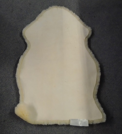 BABIES SHEEPSKIN COMFORTER / PRAM LINER.  MATERIALS 100% SHEEPSKIN.  THE SHEEPSKIN IS TANNED AND READY FOR USE.  SUGGESTED USE AS A PRAM LINER, IN CHILD'S NURSERY OR BEDROOM.