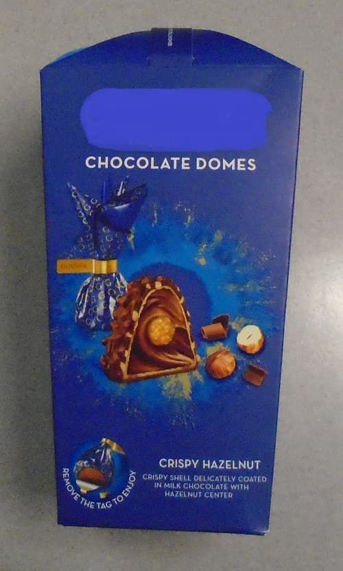 MILK CHOCOLATE DOMES.  A CRISPY SHELL COATED IN MILK CHOCOLATE WITH HAZELNUT CENTRE.  THE INDIVIDUALLY WRAPPED CHOCOLATES ARE DOME SHAPED WITH AN APPROXIMATE BASE DIAMETER OF 3 CMS.  THE CHOCOLATES ARE PACKAGED IN A BOX READY FOR RETAIL SALE.  TOP OPENING BOX MEASURES 18 CMS (HEIGHT) X 9 CMS (WIDE) TAPERING TO 7CMS AT BASE.  

INGREDIENTS: 

CHOCOLATE, HAZELNUT CREAM, HAZEL CLUSTER, HOLLOW WAFER, FLAT WAFER AND HAZELNUT PIECES