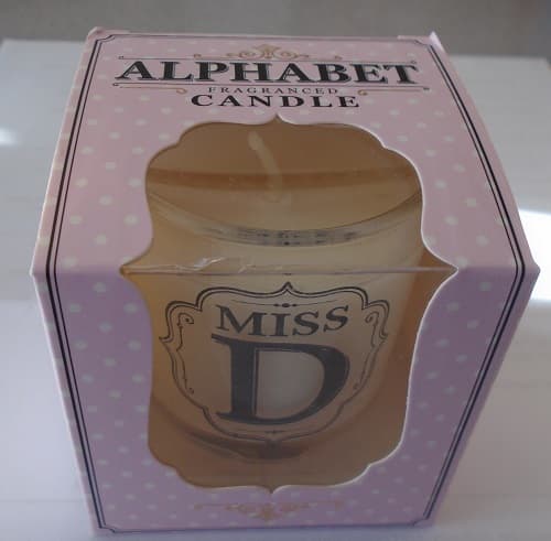 FRAGRANCED CANDLE IN A SMALL GLASS RECEPTACLE.  GLASS RECEPTACLE IS PRINTED WITH MESSAGE AND ALPHABET LETTER.  FRAGRANCED CANDLE IS PACKAGED READY FOR RETAIL SALE IN SMALL CARDBOARD BOX WITH PLASTIC WINDOW.  BOX MEASURES 65 MM (HIGH) X 62 MM (WIDTH) X 62 (DEPTH).  BOX CAN BE PERSONALISED TO GIVE AS A GIFT.