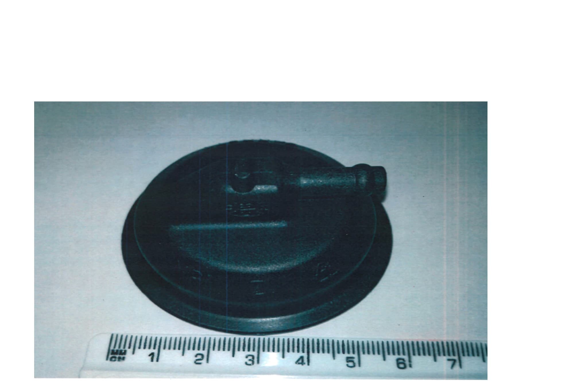 A PLASTIC COVER MADE OF PLASTIC. IT IS ASSEMBLED INTO A TURBO CHARGER ACTUATOR. THE ACTUATOR CONTROLS A VALVE ON A TURBO CHARGER THAT CONTROLS THE SPEED OF THE TURBO CHARGER. THE ACTUATOR IS ATTACHED TO AN AUTOMOTIVE ENGINE.