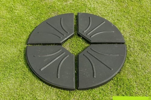 FOUR PART BASE FOR GARDEN UMBRELLA / PARASOL.  FOUR QUARTER SECTIONS PER SET.  EACH SECTION IS MADE OF CONCRETE.  PACKED IN A STANDARD EXPORT CARDBOARD CARTON.