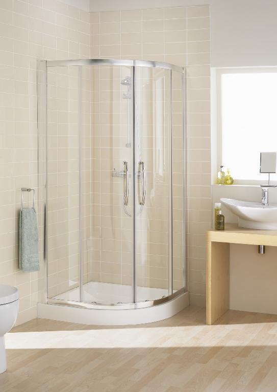 A PARTIALLY ASSEMBLED BATHROOM SHOWER ENCLOSURE KIT DESIGNED TO BE MOUNTED AND FIXED BETWEEN TWO WALLS AS A QUADRANT SLIDING UNIT. THE KIT CONSISTS OF FIXED PANELS: TWO FIXED PANELS, WITH 6MM SAFETY GLASS FRAMED WITH ALUMINIUM PROFILES & INCLUDING ALL SEALS (MAGNETIC, FOR CLOSING THE DOOR PANELS, AND EDGE SEALS FOR SEALING BETWEEN FIXED AND MOVABLE PARTS) TWO CURVED 6MM GLASS DOORS, FRAME FREE, INCORPORATING WHEEL ASSEMBLIES AT EACH CORNER AND SEALS. THE DOORS ARE MOVABLY MOUNTED (SLIDING) TO THE FIXED PANEL AS SUPPLIED. WITH FIXING DEVICES, SCREWS, WASHERS AND COVER CAPS.