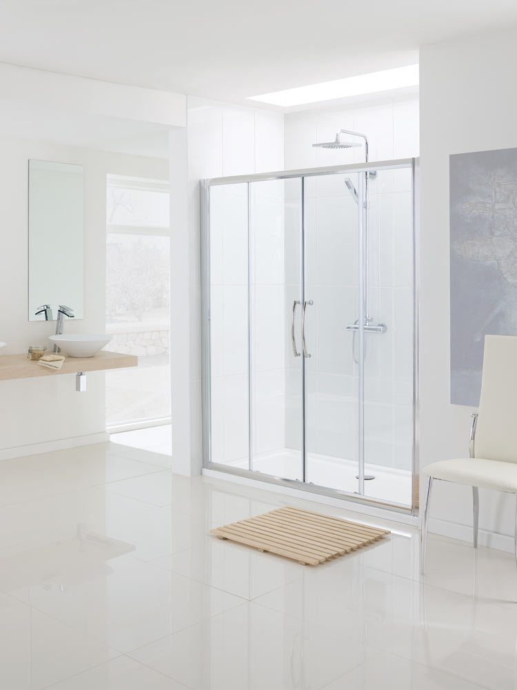 A PARTIALLY ASSEMBLED BATHROOM SHOWER ENCLOSURE KIT DESIGNED TO BE MOUNTED AND FIXED BETWEEN TWO WALLS AS A SLIDING DOOR UNIT. THE KIT CONSISTS OF ONE DOOR PANEL WHICH IS FRAME FREE AND MADE FROM 6MM SAFETY GLASS, INCORPORATING WHEEL ASSEMBLIES AT EACH CORNER & SEALS  WHICH ARE MAGNETIC FOR CLOSING THE DOOR AND A FIXED PANEL FOR EITHER SIDE WHICH ARE FRAMED. WITH FIXING DEVICES, SCREWS, WASHERS AND COVER CAPS.