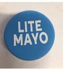 A PLASTIC LID WRAP LABEL USED TO ATTACH TO PLASTIC BOTTLES TO IDENTIFY THE CORRECT FLAVOUR OF SAUCE (SWEET ONION). USED TO PROVIDE A CLOSURE. THE COVER HAS NO THREAD. USED IN QUICK SERVICE RESTURANTS. MADE FROM 100% FOOD GRADE SILICONE. DURABLE AND REUSABLE.