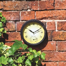 WALL MOUNTED CLOCK WITH A IRON SURROUND PAINTED BLACK.
FOR INDOOR OR OUTDOOR USE.
THERE IS A THERMOMETER SET INSIDE THE FACE OF THE CLOCK WITH A 20CM FACE AND ROMAN NUMERALS.
BATTERY OPERATED, REQUIRES 1 X AA BATTERY WHICH IS NOT INCLUDED.
PACKAGED FOR RETAIL SALE IN A PRINTED, COLOURED CARDBOARD BOX.
