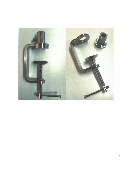 STEEL CLAMP USED FOR SLIMLINE TABLE LAMP, SO THAT THE LAMP CAN BE CLAMPED TO THE TABLE.  CLAMP IS MADE FROM OPEN DIE FORGED STEEL.  CLAMP IS TIGHTENED AND LOSENED BY A HAND MECHANISM. NOT FOR USE AS PART OF A MACHINE.