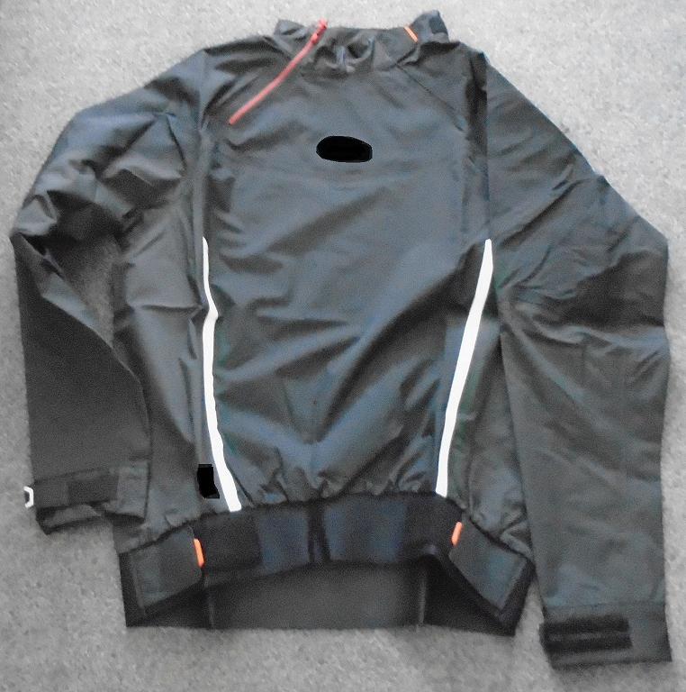 WOVEN GARMENT FOR UNISEX. REACHING DOWN TO BELOW THE WAIST. ROUND NECK WITH HIGH STANDING COLLAR, WITHOUT OPENING, BUT WITH INSERTS BEHIND, WITH A PARTIAL ZIP AT RIGHT COLLAR AND VELCRO TAB AT LEFT COLLAR ENABLING SIZE OF OPENING AT NECK TO BE INCREASED TO PULL OVER HEAD. LONG SLEEVES, WITH TIGHT FITTING CUFFS OF PLASTIC.  WITH ADJUSTABLE HOOK AND LOOP TAPE TIGHTENING. WITH PRINTED LOGOS ON CHEST AND SHOULDER. WITH ONE WHITE STRIP ON EITHER SIDE OF THE FRONT OF THE GARMENT FROM THE BASE OF THE GARMENT MEASURING APPROXIMATELY 32 CM UPWARDS. WITH ADJUSTABLE HOOK AND LOOP TAB TIGHTENING AT THE BASE WHICH IS MADE FROM A CELLULAR NEOPRENE RUBBER WITH A KNITTED TEXTILE ON ONE SURFACE ONLY. THE MAJORITY OF THE GARMENT IS MADE OF A WOVEN TEXTILE WITH A LIGHTWEIGHT THREE LAYER WATERPROOF AND BREATHABLE CONSTRUCTION, CONSISTING OF 100% NYLON WOVEN FACE AND LAMINATED BACKER WITH A PTFE MEMBRANE IN BETWEEN. THE OUTER SURFACE IS MADE OF 100% NYLON. PACKAGED IN A CLEAR PLASTIC BAG WITH A PRINTED BARCODE, GARMENT DESCRIPTION, PRODUCT CODE AND SIZE.