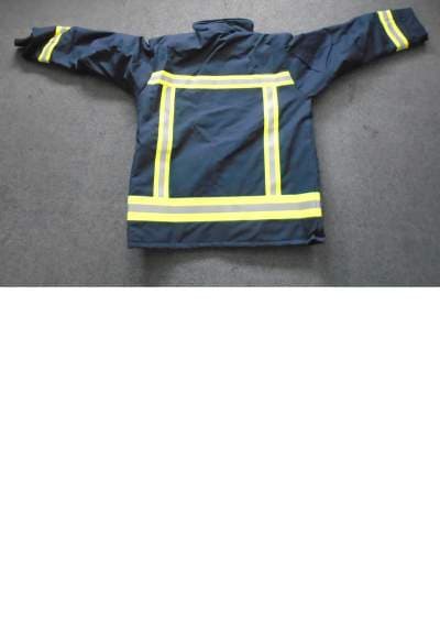 THIS IS A MANS LONG SLEEVED STRUCTURAL FIRE PROTECTIVE COAT. IT REACHES TO BELOW THE WAIST. THIS IS MADE FROM A WOVEN GORE TEX MATERIAL. IT IS NAVY BLUE IN COLOUR WITH TWO FRONT POCKETS, WITH A HIDDEN INTERNAL POCKET. THERE ARE YELLOW AND SILVER REFLECTIVE STRIPS AT EACH WRIST, ACROSS THE CHEST AND AROUND THE BASE OF THE JACKET AND AT THE BACK. IT HAS A ZIP AND LEFT OVER RIGHT VELCRO FASTENING AT THE FRONT.