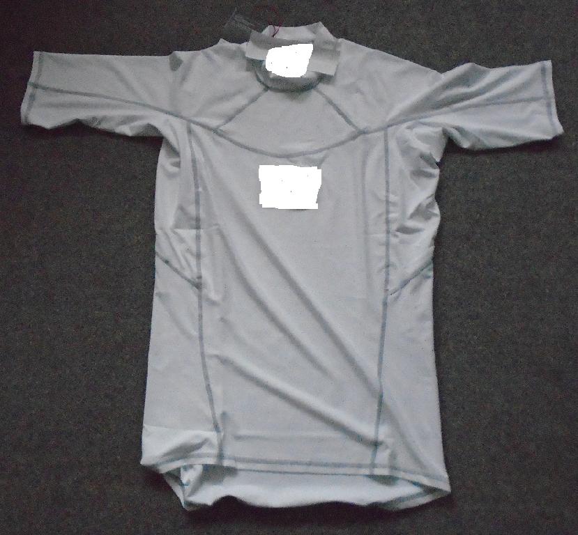 A WHITE KNITTED T-SHIRT FOR UNISEX. REACHING DOWN TO BELOW THE WAIST. WITH A ROUND NECK WITHOUT AN OPENING. WITH A 3CM DEEP BAND AROUND THE NECKLINE. WITH SHORT SLEEVES. THE GARMENT IS HEMMED AT THE SLEEVE ENDS AND AROUND THE BASE. A 4 WAY STRETCH FABRIC, WITH FLAT LOCKED SEAMS FOR COMFORT. WITH THE COMPANY NAME PRINTED IN THE MIDDLE OF THE CHEST, LEFT SHOULDER THERE IS PRINTED WORDING. THE GARMENT IS MADE OF 86% POLYESTER AND 14% ELASTANE. PACKAGED IN A CLEAR PLASTIC BAG WITH A PRINTED BARCODE, GARMENT DESCRIPTION, PRODUCT CODE AND SIZE.