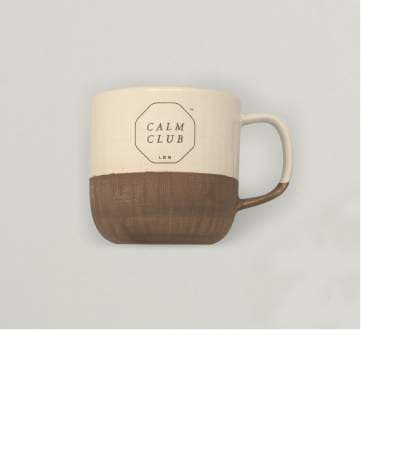 CREAM AND BROWN STONEWARE MUG WITH  A MOTIF SAYING CALM CLUB ON THE UPPER PART OF THE MUG.DIMENSIONS 3 X 3 X  4.5 INCHES. THE MUG IS 100 % GLAZED  STONEWARE. WITH HANDLE. ACCOMPANIED WITH SOCKS, PUZZLE, EYE MASK AND CANDLE WHICH WOULD ALL BE CLASSIFIED SEPERATELY.
