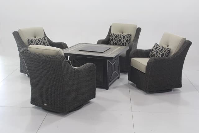 FOUR SWIVEL GLIDER CHAIRS MADE OF ALUMINIUM AND PE (POLYETHYLENE) WICKER WITH CUSHIONS AND PILLOWS ALONG WITH A TABLE/FIRE PIT WHICH IS MADE FROM TILES, ALUMINIUM AND RESIN WITH A FIRE GLASS TOP. DIMENSIONS FOR THE TABLE/FIRE PIT ARE 106.2CM X 106.2CM X 63.1CM AND DIMENSIONS FOR THE CHAIRS ARE 80.5CM X 85.5CM X 91.5CM.