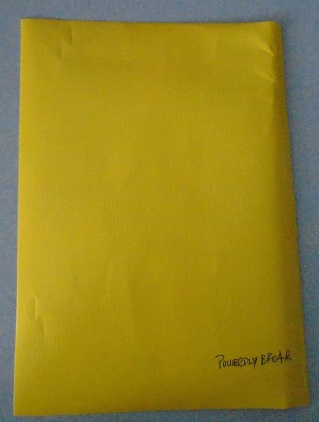 A NON-WOVEN TEXTILE CONSISTING OF FOUR LAMINATED LAYERS. 
THE FIRST LAYER IS A SPUN BOUND NON-WOVEN OF STAPLE FIBRES OF HIGH DENSITY POLYETHYLENE (HDPE) . WHITE IN COLOUR, WEIGHING 100 GRAMS PER METRE SQUARED
THE SECOND LAYER IS A HIGH DENSITY POLYETHYLENE (HDPE) REINFORCEMENT SCRIM, INDETERMINATE COLOUR LOOKS LIKE WHITE/CREAM WEIGHING 40 GRAMS PER METRE SQUARED
THE THIRD LAYER IS A LOW DENSITY POLYETHYLENE, INDETERMINATE COLOUR LOOKS LIKE WHITE/CREAM WEIGHING 40 GRAMS PER METRE SQUARED
THE FORTH LAYER IS A  CO-EXTRUDED BARRIER FILM MADE OF POLYETHYLENE (PLASTIC) YELLOW IN COLOUR. WEIGHING 120 GRAMS PER METRE SQUARED.
THE PRODUCT IS USED IN THE PRODUCTION OF PROTECTIVE CLOTHING
IT IS PRESENTED ON ROLLS 1.53 METRES WIDE