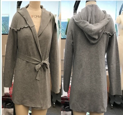 KNITTED CARDIGAN FOR UNISEX. MADE OF 88% POLYESTER AND 12% NYLON. COVERING THE UPPER PART OF THE BODY AND REACHING DOWN TO ABOVE MID THIGH. WITH NO FASTENING OTHER THAN A TIE WAIST BELT AND WITH NO RIBBING AT THE HEM OR CUFFS. WITH LONG SLEEVES AND A HOOD. HAS A FRILL ON ONE SIDE AROUND THE TOP OF THE ARM/SHOULDER. GREY IN COLOUR. AVAILABLE IN XS (LENGTH 74.93CM) UPTO XL (LENGTH 83.50CM).