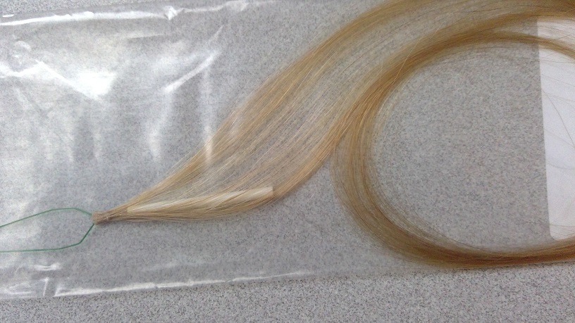 HAIR EXTENSIONS MADE OF 100% HUMAN HAIR. PREPARED ARTICLES OF HUMAN HAIR PROCESSED TO VARIOUS SPECIFIC COLOURS AND LENGTHS. THE EXTENSIONS ARE LOOSE HAIR BUNDLES WHICH ARE UNFINISHED UNTIL APPLIED TO THE PERSONS HAIR. APPLIED USING A LOOPED LINK SYSTEM, SPECIALIST LINK BEAD AND SPECIFIC TOOL FOR CRIMPING THE BEAD TIGHTLY FOR ATTACHMENT TO EXISTING HAIR ON THE PERSONS HEAD.