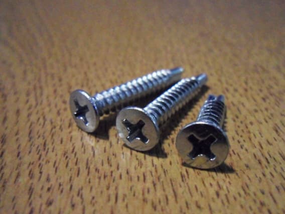 RAISED COUNTERSUNK HEAD, CROSS RECESS, SELF-TAPPING THREAD, DRILL POINT SCREW WITH ELECTRODEPOSITED ANTI-CORROSION COATING. FOR USE IN THE MECHANICAL JOINTING OF METAL, PVCU AND COMPOSITE MATERIALS