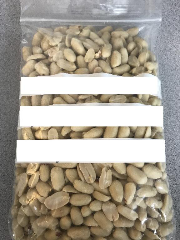 CHINESE RAW PEANUTS THAT ARE SHELLED AND BLANCHED.
THE PEANUTS ARE INSPECTED AND DESTONED. 
THE PEANUTS ARE TREATED TO A 90OC HEAT ON A CONTINUOUS BELT FOR 40 MINUTES TO LOOSEN THE SKIN AND LOWER THE PEROXIDE VALUES.
THE PEANUTS ARE THEN COOLED AND BLANCHED.
ANY DAMAGED KERNELS ARE REMOVED.  A METAL DETECTOR AND MAGNET ARE USED TO REMOVE ANY METAL FROM THE PEANUTS.
THE PEANUTS ARE PACKED IN 25KG BAGS OR LARGE TOTES FOR ONWARD PROCESSING BY CUSTOMER FOR RETAIL SALE SUCH AS ROASTING, SALTING OR FLAVOURING.