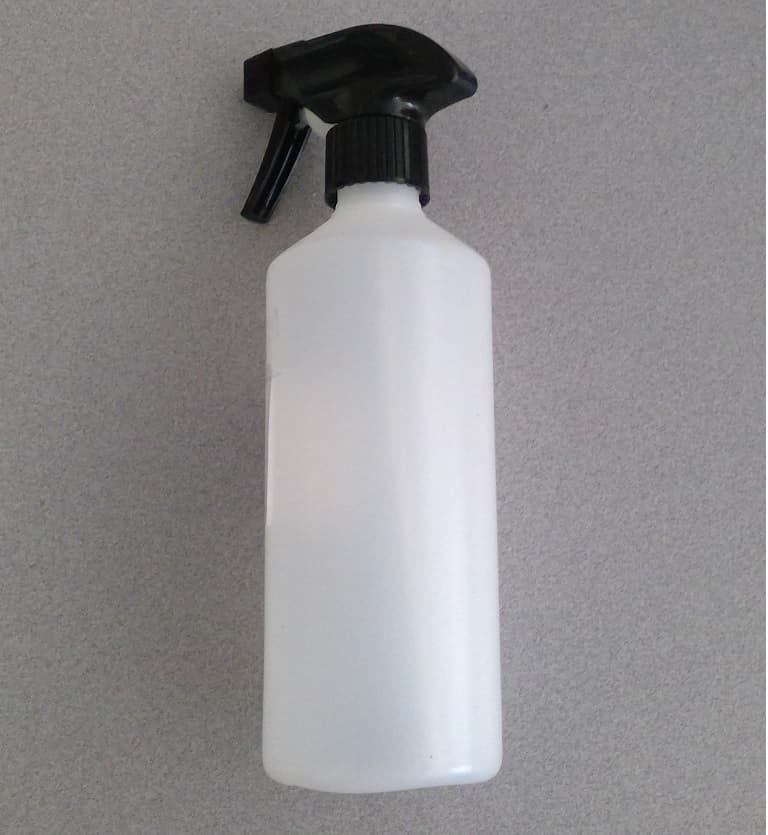 A PLASTIC PRECISION SPRAY WATER BOTTLE WITH A BLACK HEAD AND TRIGGER. HAND OPERATED. THE BOTTLE IS MADE FROM RECYCLED PE (POLYETHYLENE) PLASTIC AND RECYCLED ABS (ACRYLONITRILE BUTADIENE STYRENE) PLASTIC. MEASURING APPROXIMATELY 23 ½ CM TALL X 6 ½ CM ROUND THE WIDEST PART, TAPERING UPWARDS TO A SMALLER NECK.