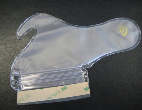 THIS PRODUCT IS AN ACCESSORY TO A HEARING AID THAT IS DESIGNED TO BE USED BY THE RECIPIENT TO GIVE THEM ADDED PROTECTION TO THEIR HEARING DEVICE WHILST THEY ARE PARTICIPATING IN WATER BASED ACTIVITIES.

THE DESIGN OF THE ACCESSORY IS A FORM FITTING BAG MADE OF TRANSPARENT PLASTIC.  IT HAS A CONVENTIONAL ZIP-LOCK SEAT AT ONE END AND A PEEL AND SEAL STYLE ADHESIVE FLAP ALLOWS THE PRODUCT TO BE WORN WHILST IN WATER, INCLUDING WATER BASED ACTIVITIES.

THE SPECIALLY DESIGNED SHAPE OF THIS ACCESSORY ALLOWS THE HEARING AID TO FIT COMFORTABLY BEHIND THE EAR.

THE DEVICE IS PACKED IN A PROTECTIVE TE PLASTIC SLEEVE, PACKED IN SETS OF 5,15 OR 30 PRODUCTS, AND IS SOLD ONLINE TO REGISTERED RECIPIENTS AND VIA OFFICIAL AUTHORISED DISTRIBUTORS AND HOSPITALS ONLY.