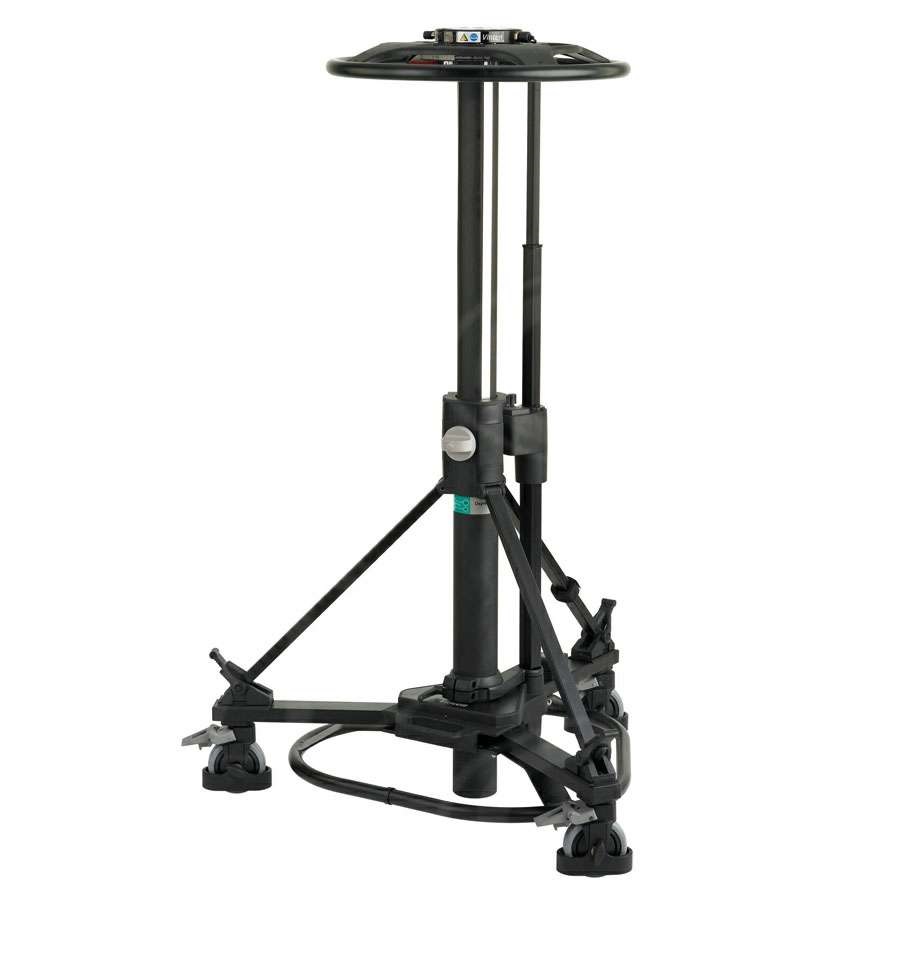 A TV STUDIO CAMERA PEDESTAL. IT HAS A 40 KG / 88.2 LBS CAPACITY WITH CRABBING BASE CAPABILITY. THIS SINGLE STAGE PEDESTAL HAS AN ON-SHOT STROKE OF 54 CM / 21.2 INCH AND A WHEEL BRAKING MECHANISM. IT HAS AN INTEGRAL MANUAL PUMP AS WELL AS AN INLET VALVE FOR USE WITH EXTERNAL PRESSURE SOURCES.