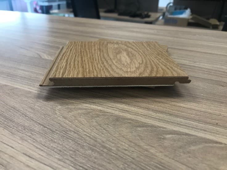 THIS PRODUCT ARE PRE-FINISHED OAK WOOD MULTI-LAYERED BOARD-LIKE PARQUET PANELS DESIGNED FOR USE AS A SITE ASSEMBLED SEMI-STRUCTURAL FLOOR COVERING.  THE PRODUCT IS NOT A DECORATIVE VENEERED LAMINATE.

THE BOARD LIKE PARQUET PANELS ARE IN THE FORM OF A 3-LAYER PANEL (1200MM LONG X 150MM WIDE X 10MM THICK) AND ARE COMPOSED OF AN APPROXIMATE 2MM THICK.  THEY ALSO HAVE A LOWER BALANCING LAYER OF POPLAR WOOD, A 6MM THICK STRUCTURAL MIDDLE LAYER FROM HIGH-DENSITY WOOD-FIBRE, AND A 2MM THICK OAK TOP WEAR LAYER SURFACE WITH A HARDWEARING LACQUER FINISH THAT IS CAPABLE OF BEING SANDED BACK AND REFINISHED, WHICH IS DIFFERENT FROM A DECORATIVE VENEER. 

THE 3 LAYERS ARE DESIGNED TO PROVIDE A MULTI-DIRECTIONAL STABLE BOARD STRUCTURE. THE EDGES ARE PROFILED TO A CLICK SYSTEM, FOR USE AS A SEMI-STRUCTURAL PRE-FINISHED PARQUET FLOOR COVERING.  THE 'COMPOSITE FLOOR SLAB' IS MADE OF WOOD, NOT MADE OF BAMBOO, AND NOT FOR MOSAIC FLOORS.