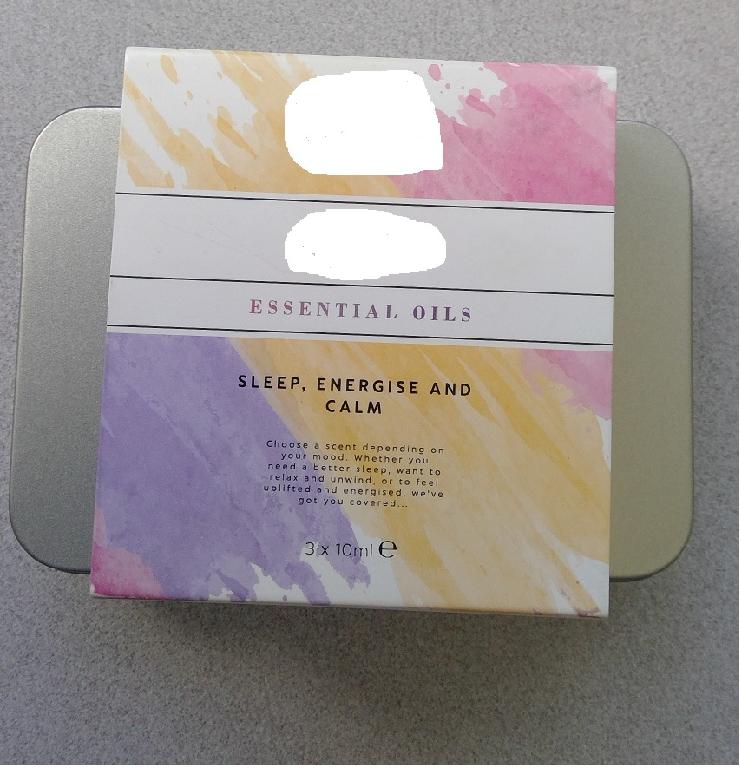 AN ESSENTIAL OILS SET CONSISTING OF SLEEP, ENERGISE AND CALM ESSENTIAL OILS. SLEEP OIL CONSISTS OF A HERBAL BLEND OF LAVENDER, SWEET BASIL AND DRIED ROSEMARY, WITH A HINT OF LIME, JASMINE AND PEPPER, A HEART OF THYME AND A BASE OF CLOVE. ENERGISE OIL CONSISTS OF A WARM CITRUS TOP NOTES BURST TO LIFE WITH JUICY LEMON AND SWEET ORANGE, BLOOMING INTO A WARM HEART OF GRAPEFRUIT AND CRISP AROMATIC ROSEMARY. CALM OIL CONSISTS OF SWEET NOTES OF YLANG YLANG ARE BLENDED WITH ORANGE AND WARM AMBER, RESTING ON A WOODY BASE OF PATCHOULI AND FRANKINCENSE. TO USE POUR A SMALL AMOUNT OF OIL ONTO YOUR WRISTS AND RUB IN A CIRCULAR MOTION. PACKAGED IN 3 X 10 ML BOTTLES THAT ARE IN A SMALL METAL TIN, WITH A COLOURFUL CARDBOARD SLEEVE.