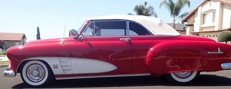 1951 CHEVROLET CONVERTIBLE DELUXE, ORIGINAL ENGINE REPLACED WITH 6964CC PETROL ENGINE, LEFT HAND DRIVE, BODY COLOUR AND INTERIOR RED AND WHITE WITH 2 DOORS AND 2 SEATS.