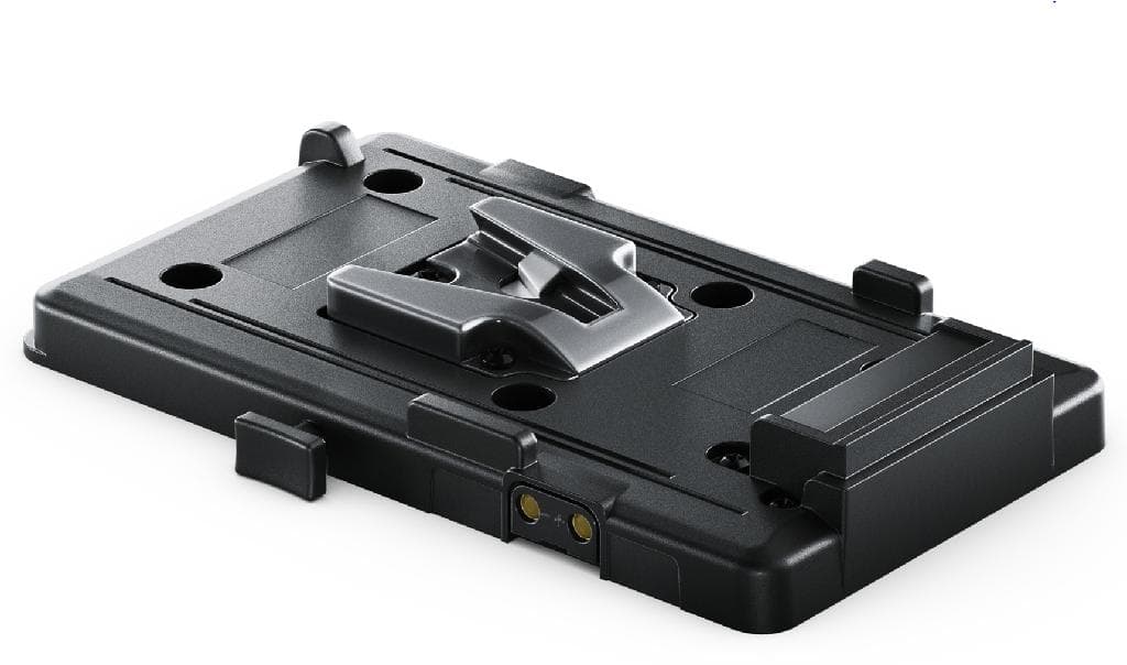 A CAMERA BATTERY PLATE.
USED AS AN ACCESSORY TO ENABLE A BATTERY TO BE ATTACHED/FIXED TO THE CAMERA. CONSISTING OF A METAL PLATE WHICH BOLTS TO THE REAR OF A CAMERA TO ALLOW BATTERIES TO BE MOUNTED TO THE CAMERA VIA THE V LOCK MECHANISM. A WIRE IS AT THE BACK OF THE PLATE TO CONNECT THE PLATE TO THE CAMERA.
THE OUTER CASE IS MADE OF PLASTIC.  
SIZE: 5.6 x 3.6 x 0.8 INCHES.